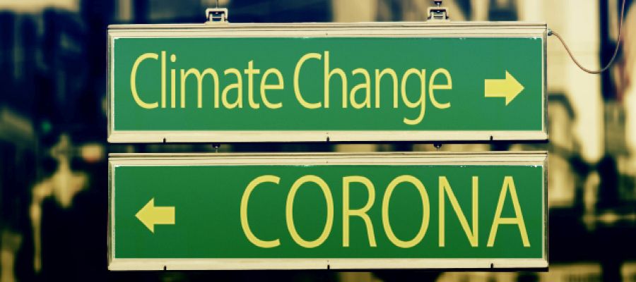 Wegweiser einer in Richtung Corona der andere Richtung Klimawandel